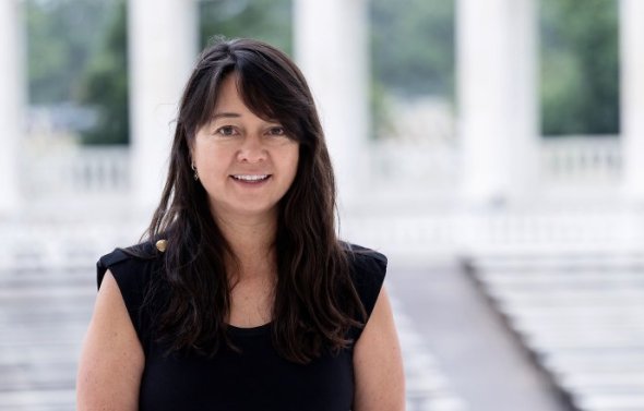 A woman in front of a set of steps.