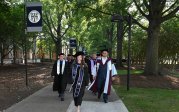 Graduates process on Kaufman Mall