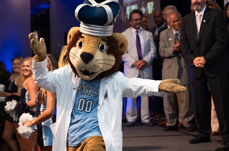 odu mascot in white lab coat